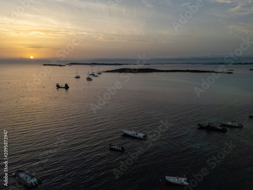 Boats anchoring in Piantarella lagoon during sunset