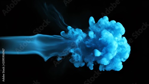 A striking black and white photograph captures the fluid, swirling motion of ink dispersing in water, creating an abstract and artistic visual.