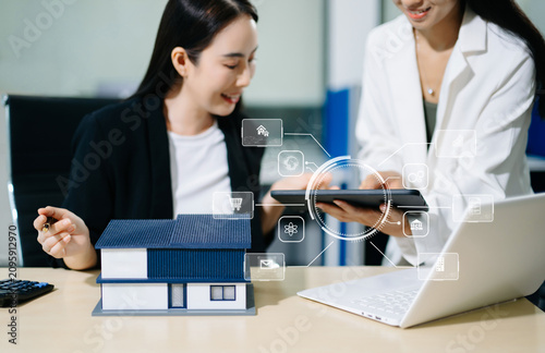 Asian real estate consultants using digital PropTech technology, smart property tools and tablet for home investment, mortgage planning and modern business.