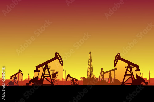 Konstfotografi Oil pumps and derricks silhouette against a gradient sunset sky
