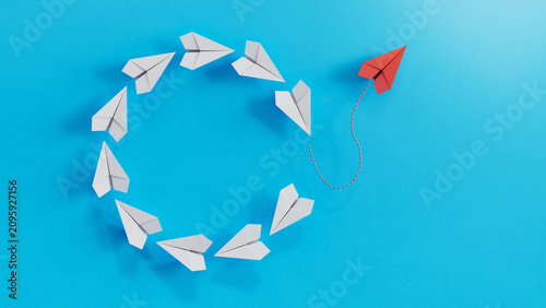 Konstfotografi Single Red Aircraft Diverges From Circle Of Conforming White Planes