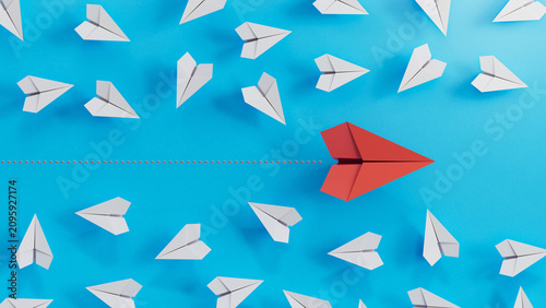 Bold Red Lead Plane Speeds Past Scattered White Paper Aircraft