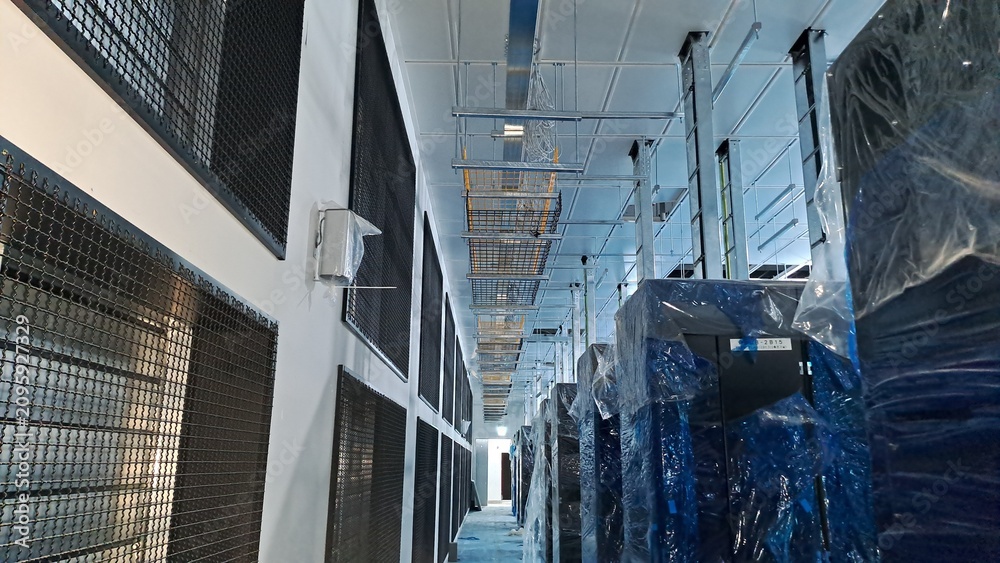 Naklejka premium Newly Constructed Data Center Server Room with IT Racks and Overhead Cable Tray Installation