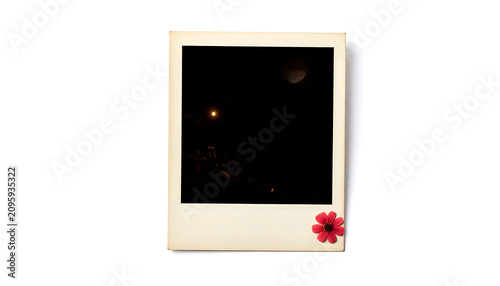 Nighttime Street Scene Inside a Polaroid Frame With a Pink Flower Sticker