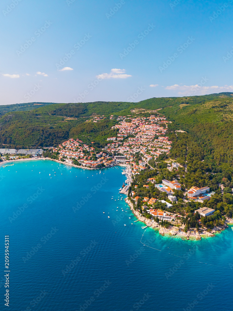 Obraz premium drone photograph of Rabac surrounded by lush green forests and the clear blue Adriatic Sea