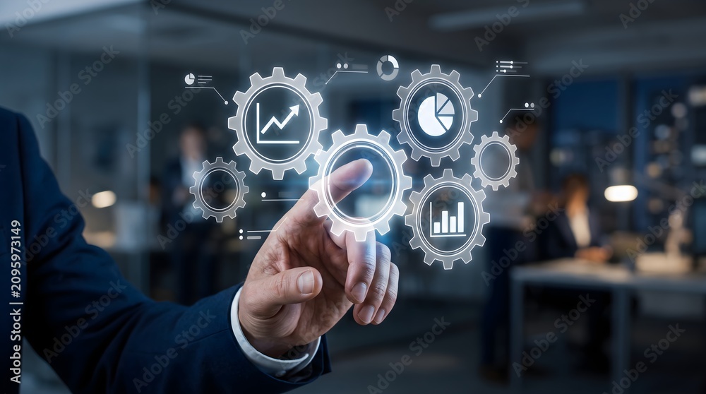 Obraz premium Businessman touching glowing digital gears with financial data charts in dark office environment and commercial technology abstract concept