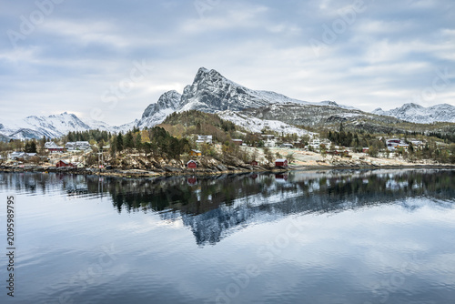 Fotografija Scenic view of the small town of Ornes in Norway with mountains and calm water d