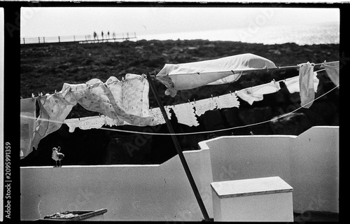 Coastal Laundry Drifting Above Whitewashed Walls