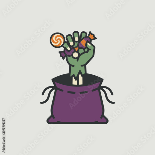 Photography A ghoulish green hand emerges from a bag, clutching Halloween sweets