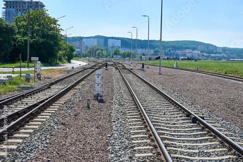 Multi-track railway junction with signals and tracks leading toward residential buildings on a hill, Gdynia, Pomerania, Poland, Europe