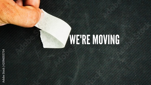 The sticker opens with the words we're moving. signifies the act of relocating from one residence to another