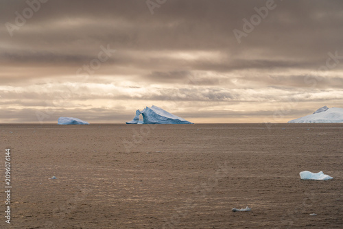 Massive Iceberg Floating in the Antarctic Ocean. Zodiac Landing During an Antarctic Expedition Cruise
