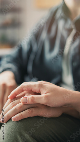 Young couple holding hands and supporting each other
