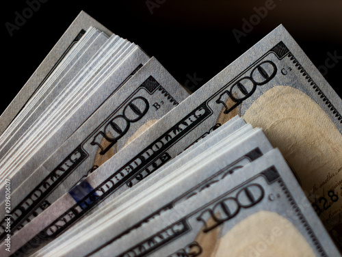 Stacks of Hundred Dollar Bills with Close-Up Focus