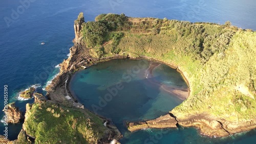 Magical island with circular lagoon Ilhéu de Vila Franca do Campo on the Azores islands in Portugal view from above