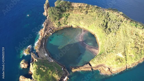 Magical island with circular lagoon Ilhéu de Vila Franca do Campo on the Azores islands in Portugal view from above