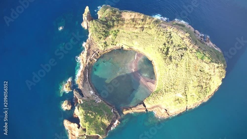 Magical island with circular lagoon Ilhéu de Vila Franca do Campo on the Azores islands in Portugal view from above