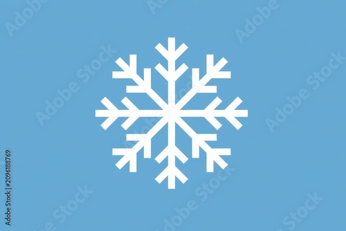 Snowflake symbol centered on a blue surface in a sharp focus macro shot for winter seasonal marketing