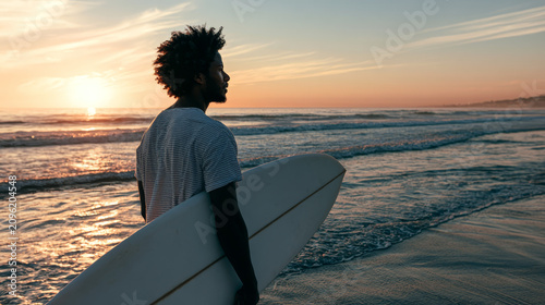 black surfer with surfboard