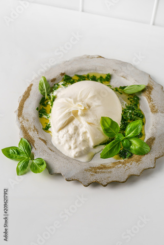 buratta cheese with basil and olive oil