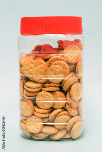 Obraz na płótnie Appetizer salty biscuits inside a plastic container