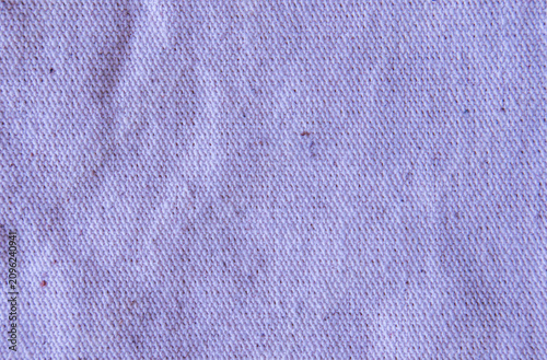Close up purple lavender cotton linen canvas texture with woven details. Natural coarse texture for design fabric background. Rough violet crumpled burlap background.