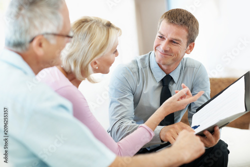 Obraz na plátně Elderly couple, document or consulting with financial advisor in home, investment planning or pension