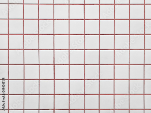 Fotografie Background of minimalist white ceramic tile wall texture with bright red cement grout