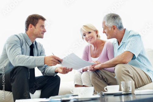 Fotografie Senior, couple and agent with paperwork in meeting for housing options, mortgage equity or explain