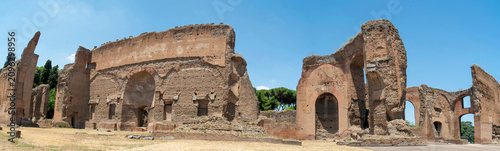 Massive ancient brick walls and soaring arches of the Baths of Caracalla in Rome, Italy
