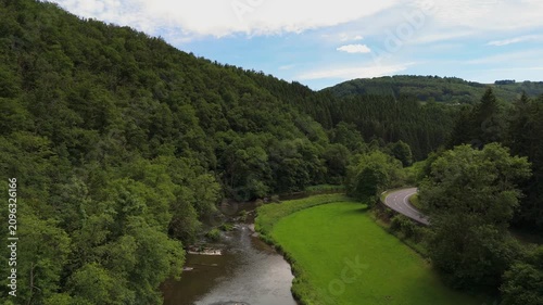 Motorcycle Cornering on Scenic Valley Road in Luxembourg