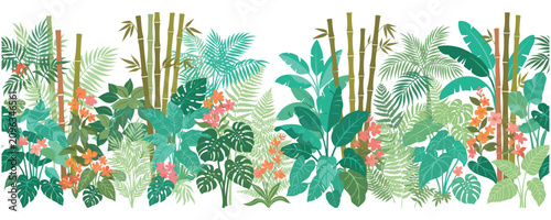 Foto Lush jungle foliage with bamboo and tropical plants and flowers.
