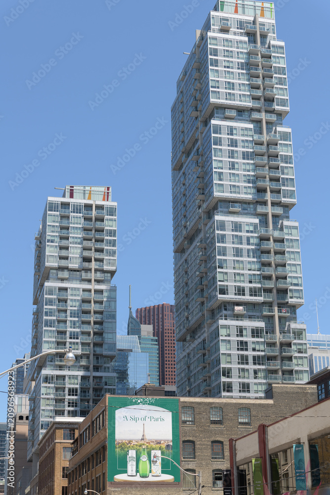 Obraz premium OOH wallscape with advertising for beverages on the exterior of the Gelber Building, 221 Richmond St W, Toronto (condo towers: Studio on Richmond)