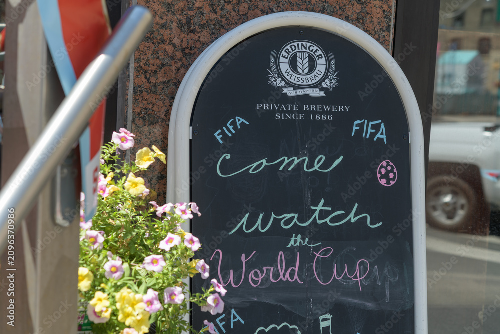 Obraz premium sidewalk chalkboard sign with Erdinger Weißbräu, “Private brewery since 1886” branding in Toronto
