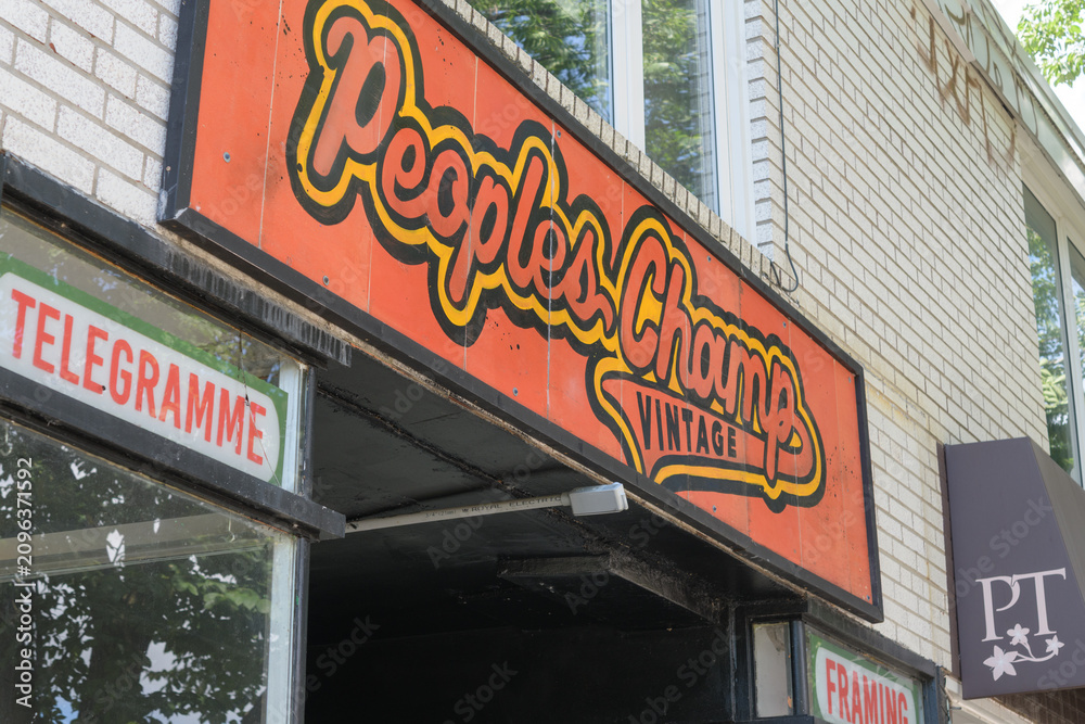 Obraz premium ghost sign (?) of People's Champ Vintage located at 709 College St, Toronto