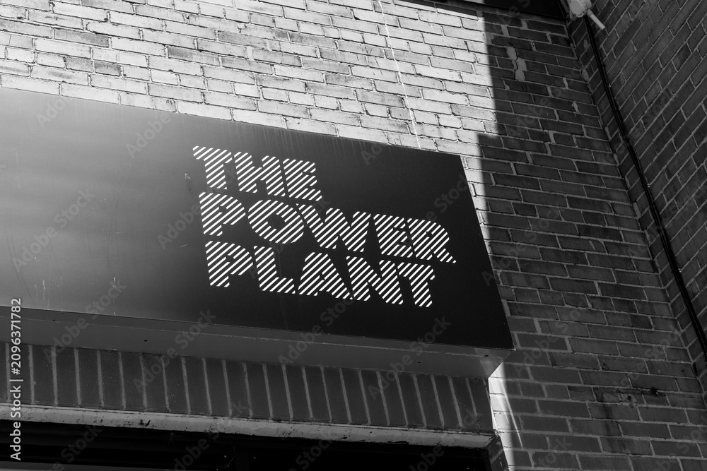 Obraz premium black and white view of sign outside The Power Plant, or The Power Plant Contemporary Art Gallery, Harbourfront Centre’s converted 1920s power station, showcasing contemporary art, Toronto