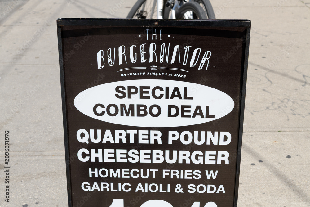 Obraz premium sidewalk sign of The Burgernator, a hamburger restaurant, located at 269 Augusta Av, Kensington Market, Toronto