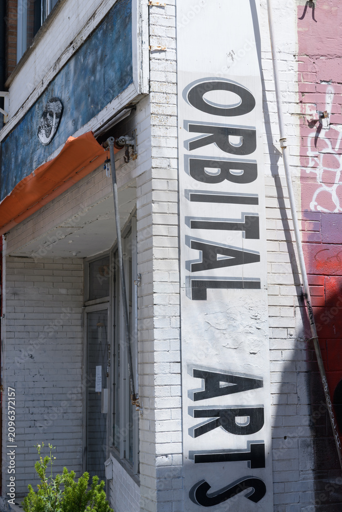 Obraz premium banner on the exterior of Orbital Arts Gallery located at 275 Augusta Av, Kensington Market, Toronto