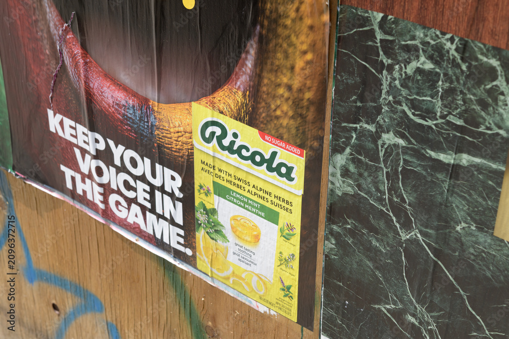 Obraz premium close-up detail of a wheatpaste poster in Toronto (Ricola with slogan re soccer tournament 