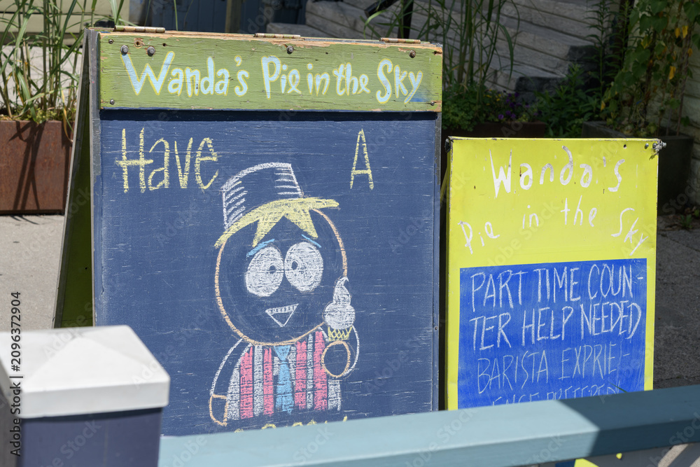 Obraz premium chalkboard signs outside Wanda's Pie in the Sky, a bakery, located at 287 Augusta Av, Kensington Market, Toronto