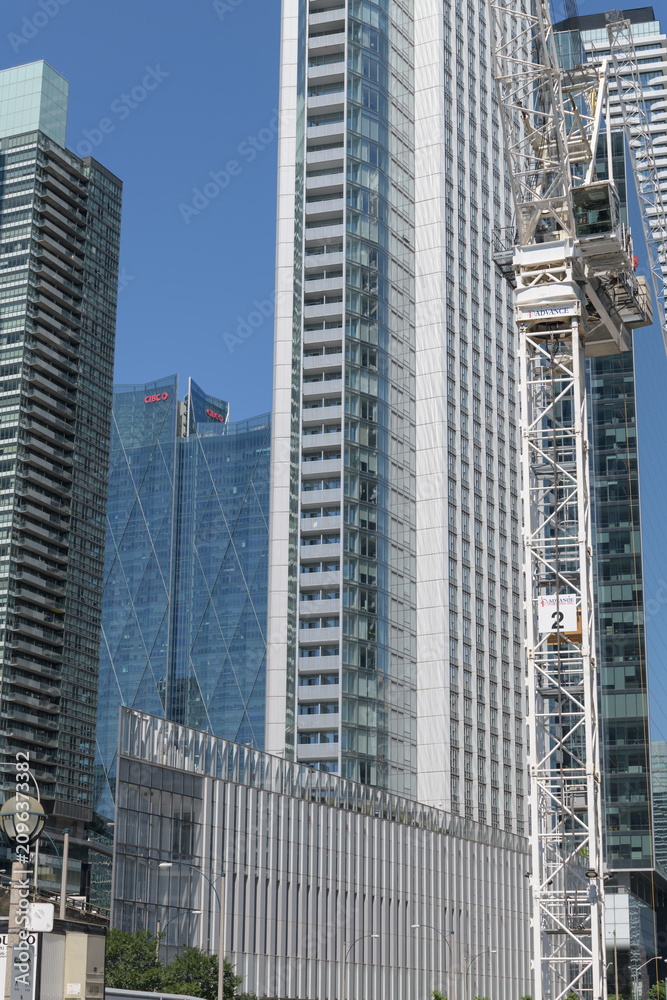 Obraz premium crane at Q Tower construction site and condo building at 10 York Street, Toronto