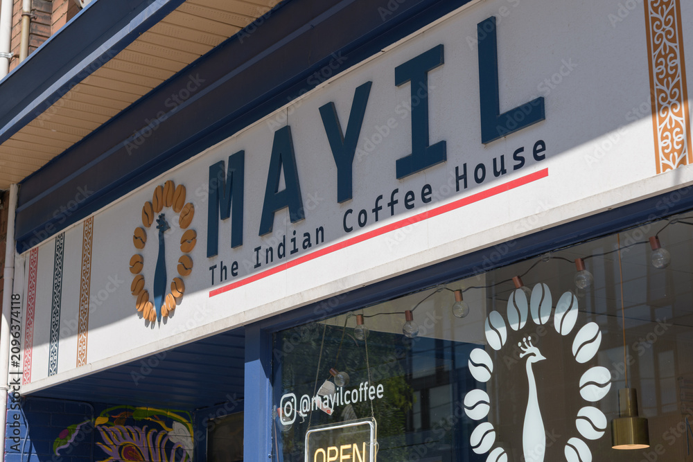 Obraz premium vinyl window sign and text at Mayil Coffee, a coffee shop, located at 870 College St, Toronto