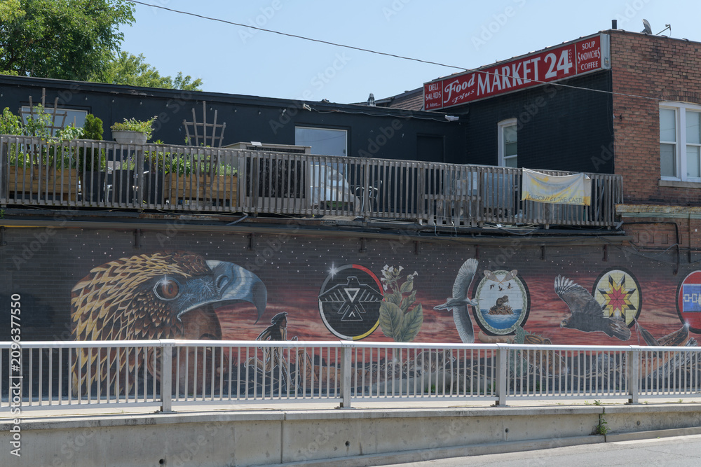 Obraz premium ghost sign, patio, and mural sponsored by Toronto's Dupont by the Castle BIA, located by underpath at Spadina Rd just north of Dupont St