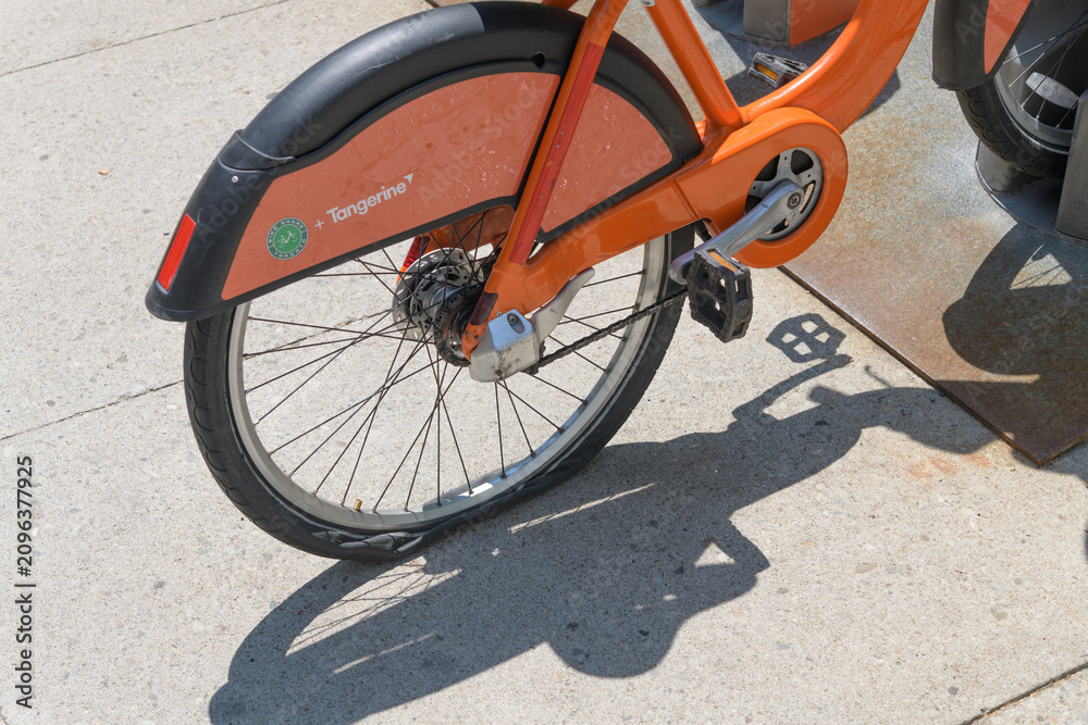 Obraz premium Bike Share Toronto rental vehicle with a flat tire