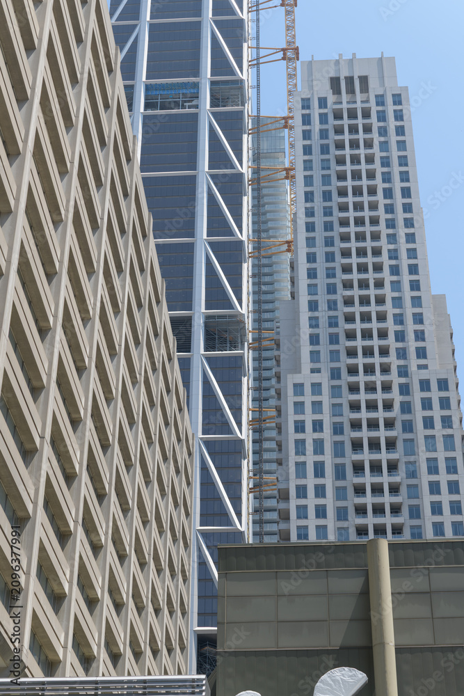 Obraz premium architectural patterns of buildings (left to right) Manulife Centre, One Bloor West, and The Uptown Residences, all near Yonge St and Bloor St, Toronto