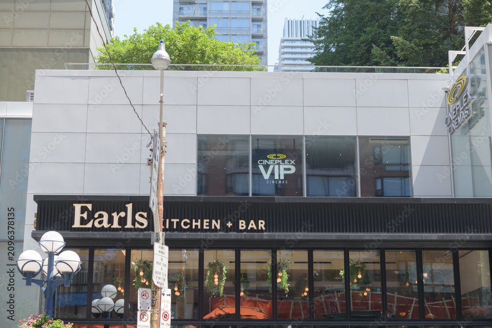 Obraz premium exterior view with sign of Earls Kitchen + Bar, a restaurant, located at 55 Bloor St W, Unit 113, inside Manulife Centre, Toronto