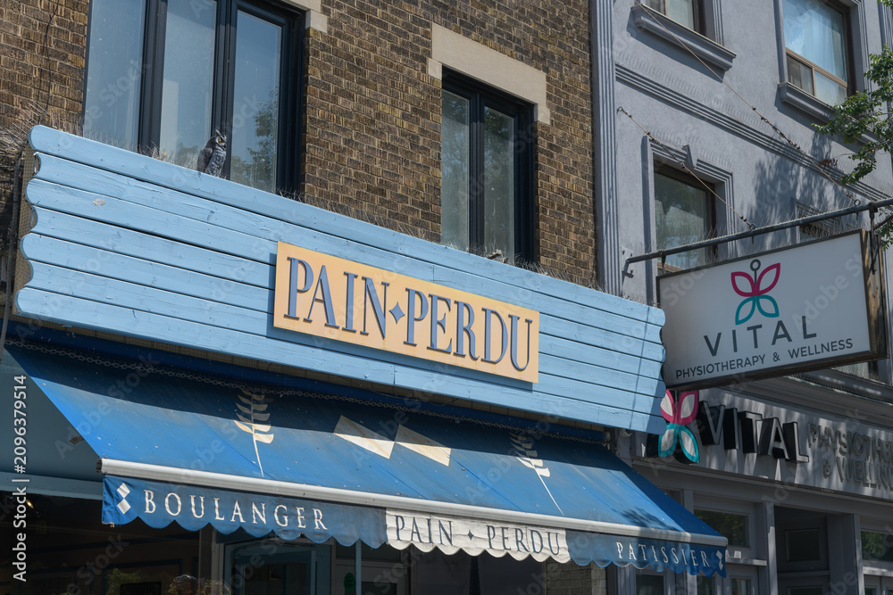 Obraz premium exterior building facade and sign of Pain Perdu, a cafe and pastry shop, located at 736 St Clair Av W, Toronto