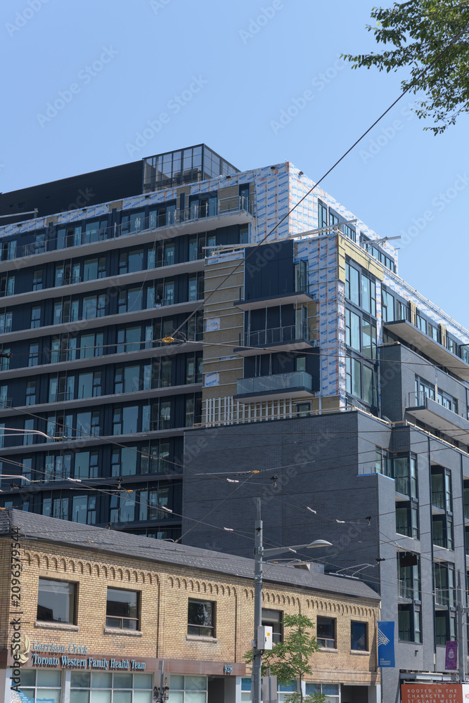Obraz premium historic building (location of Toronto Western Family Health Team – Garrison Creek site) and 908 St Clair Condos, Toronto