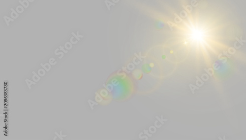 Billede på lærred Glowing golden white radiant sun in sky with multicolor rainbow optical lens fla