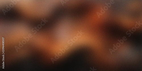 Abstract dark brown and orange blurred background with soft glowing light, atmospheric gradient texture, moody warm tones, elegant modern backdrop for creative design projects